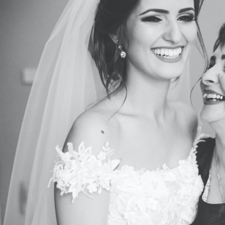 Bride and mother smiling together