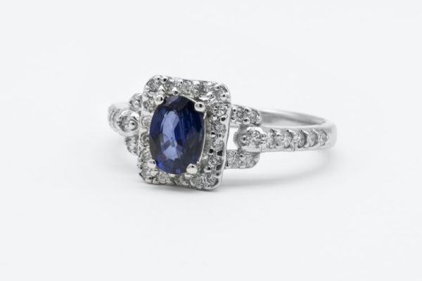 sapphire engagement ring with halo setting and pave band