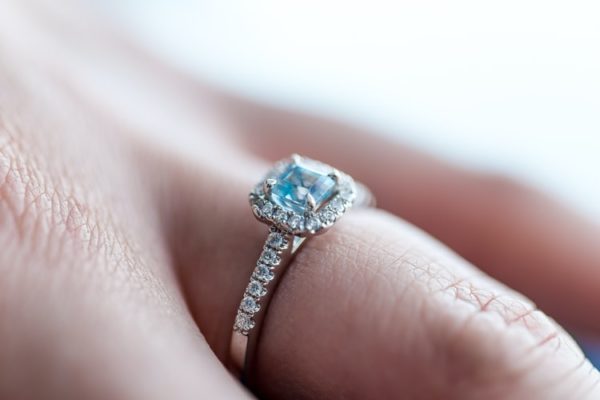 aquamarine engagement ring with halo setting and pave band