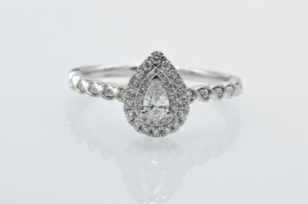 pear cut diamond engagement ring with halo setting
