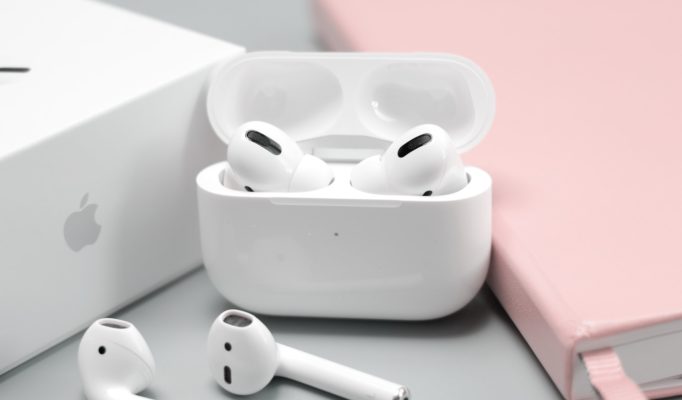 A pair of AirPods in their case.